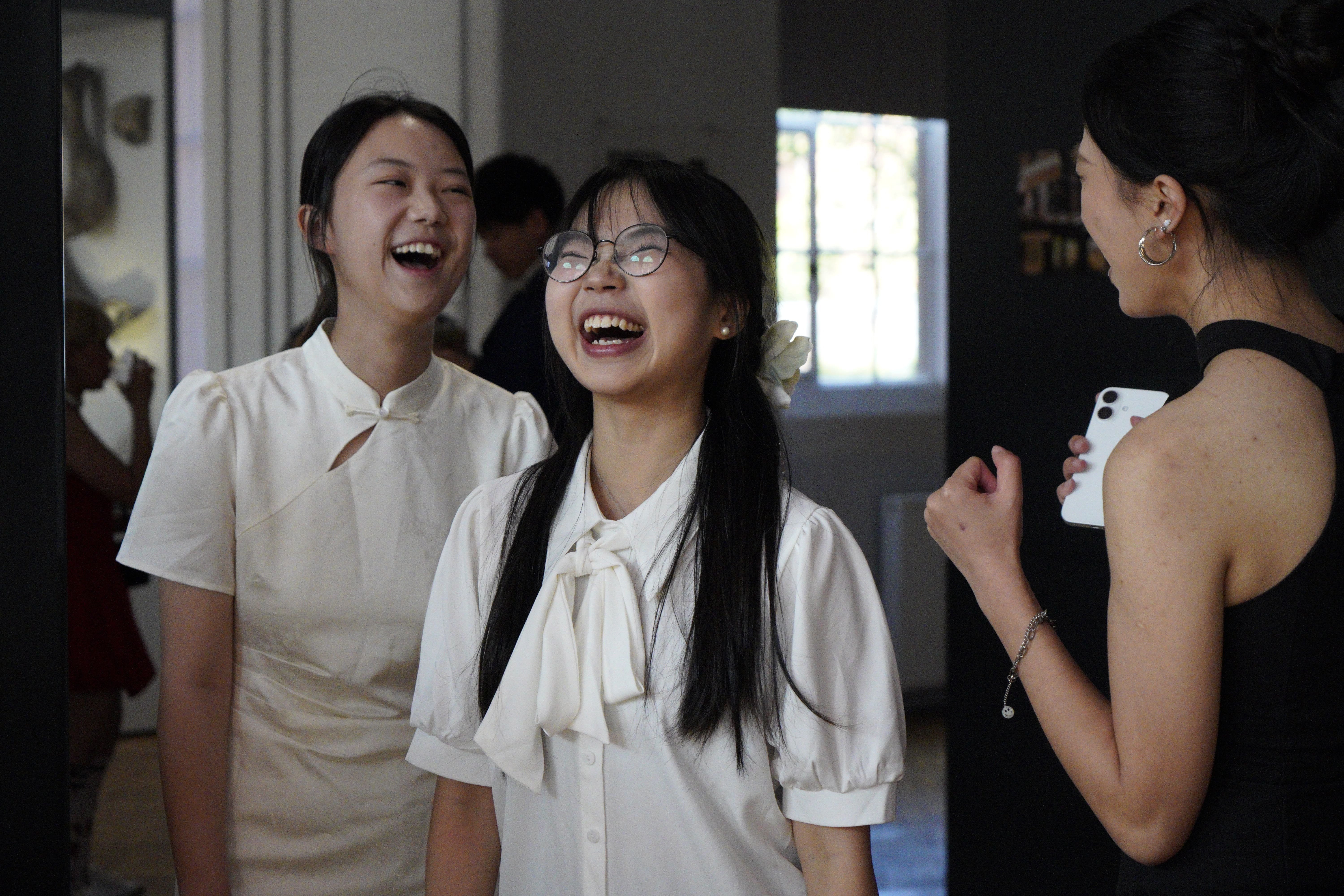 three Summer school students laughing together
