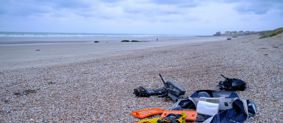 Boat items washed ashore on a beach in France