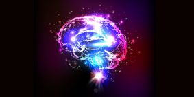 Computer generated illustration of a brain made up of blue, white and purple lights set against a black background