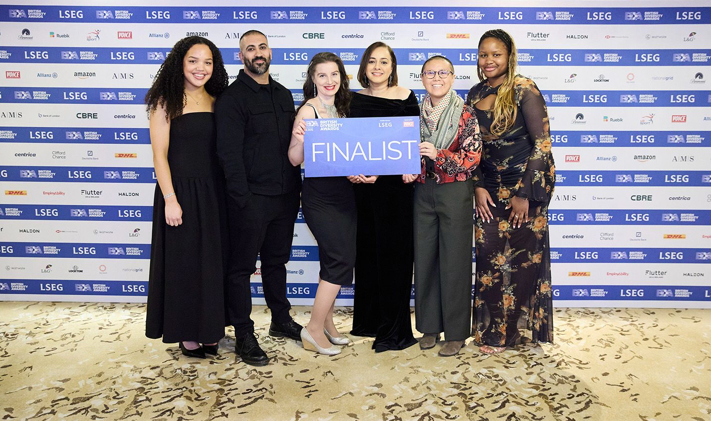 Members of the Race Equality Network posing for a group shot at the British Diversity Awards