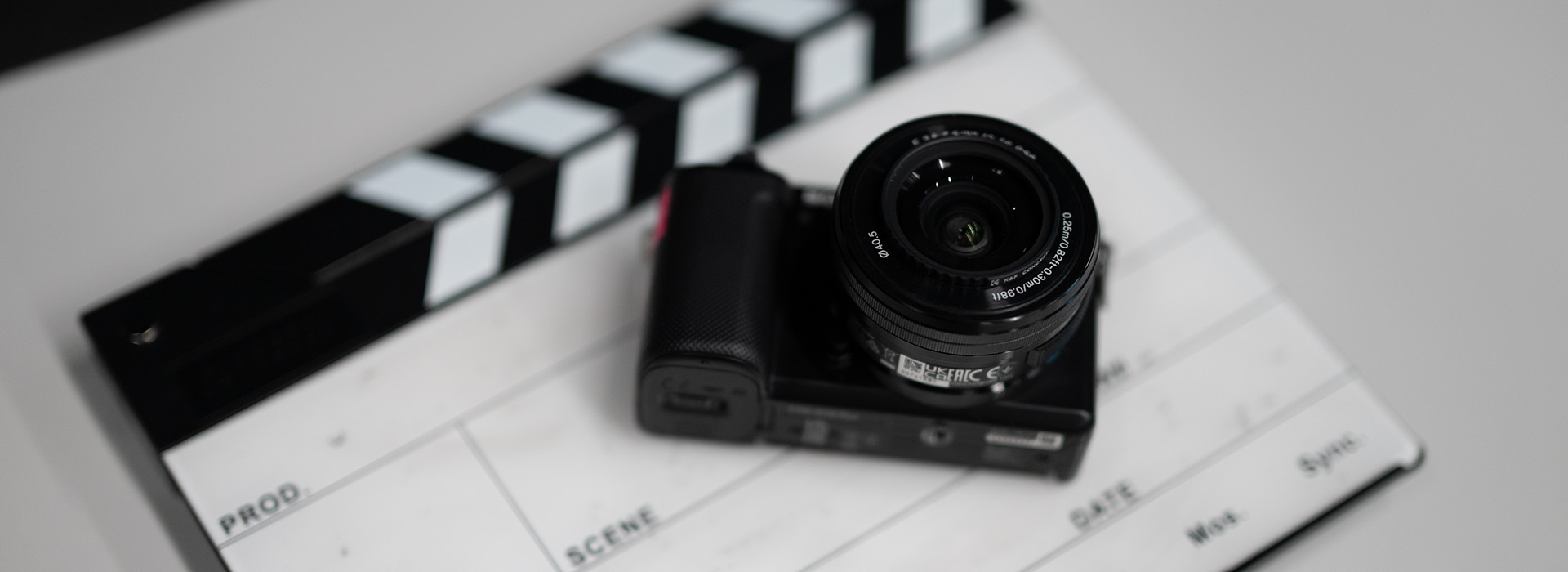 A camera sitting on a clapper board