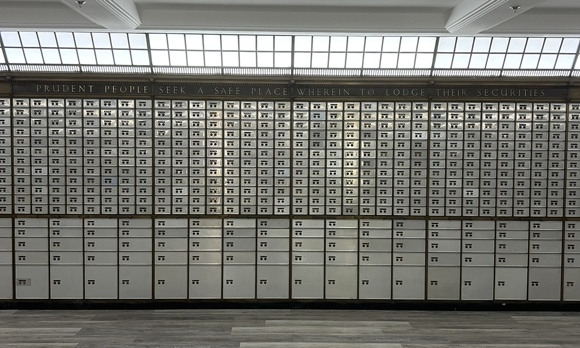 A wall of safety deposit boxes