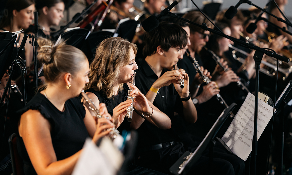 Students playing instruments in concert