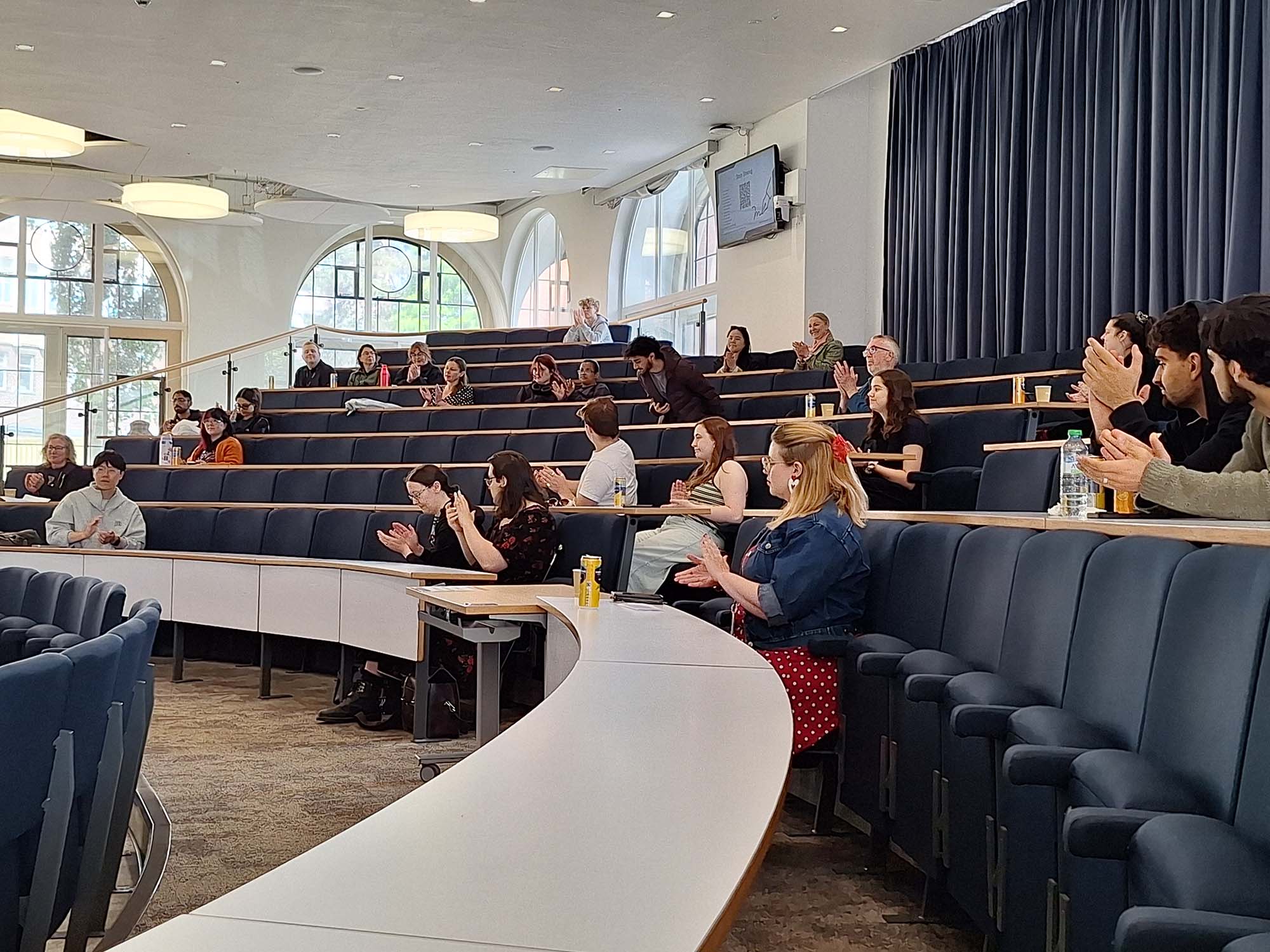 Students sitting in a lecture room at the showcase event