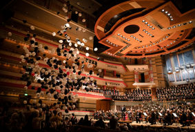 Balloons falling into the audience of the UoB Voices and CBSO performance of Carmina Burana