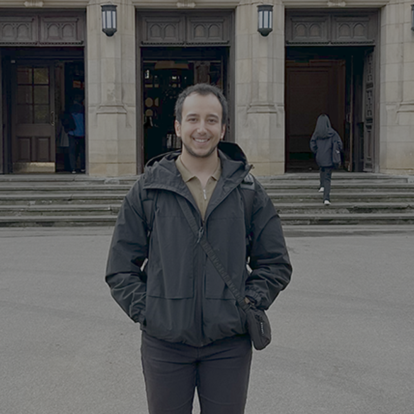 An image of Ceyhun standing infront of aston webb smiling