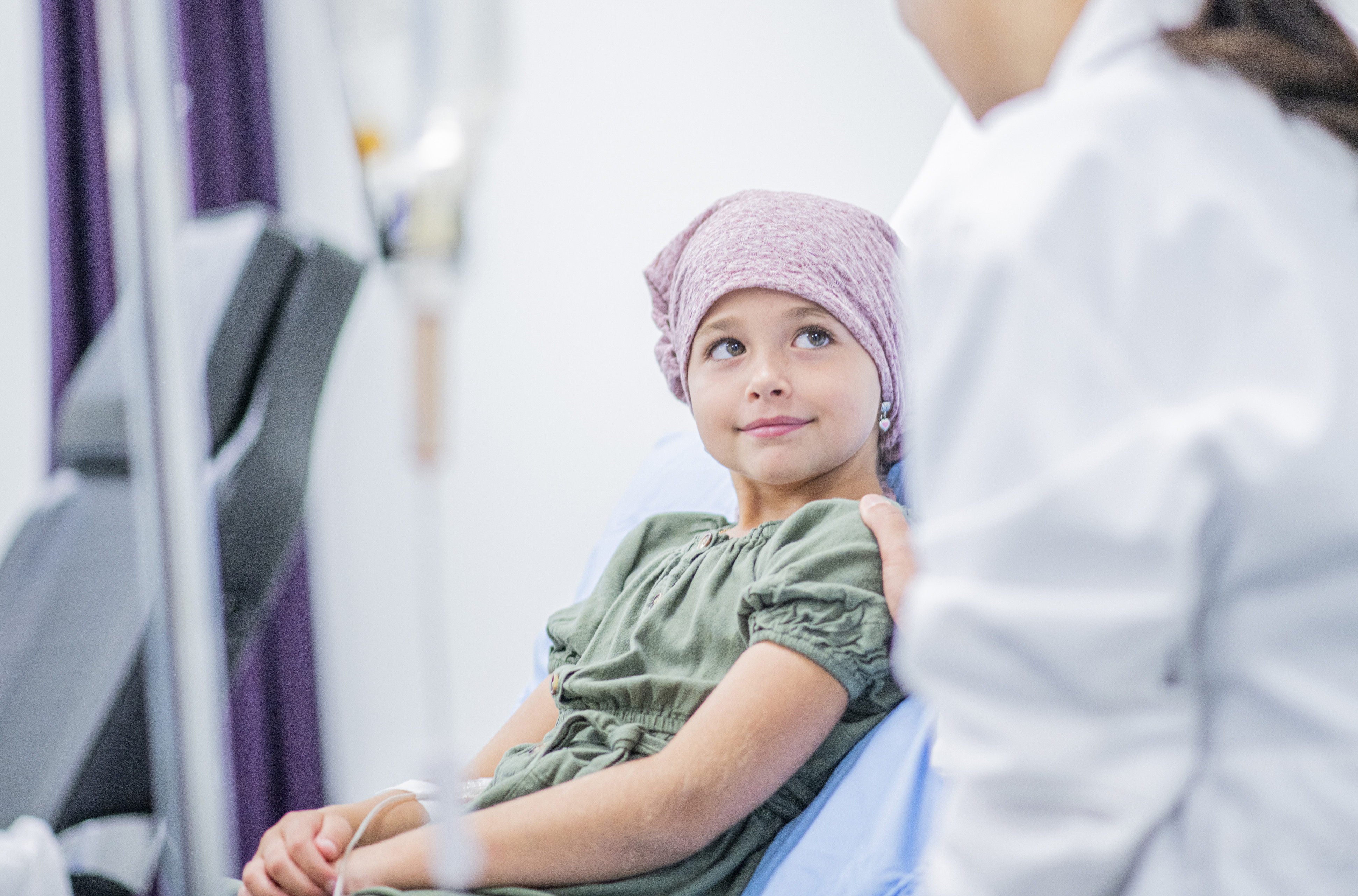 Child cancer patient on a hospital bed.