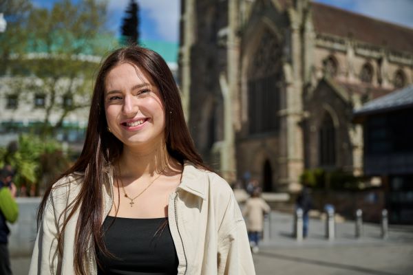 Girl smiling in front of church