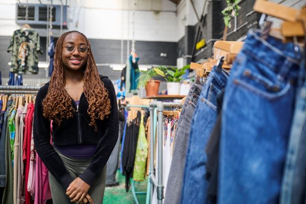 Student charity shopping smiling towards camera 