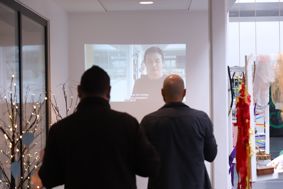 Two people viewing a workshop presentation