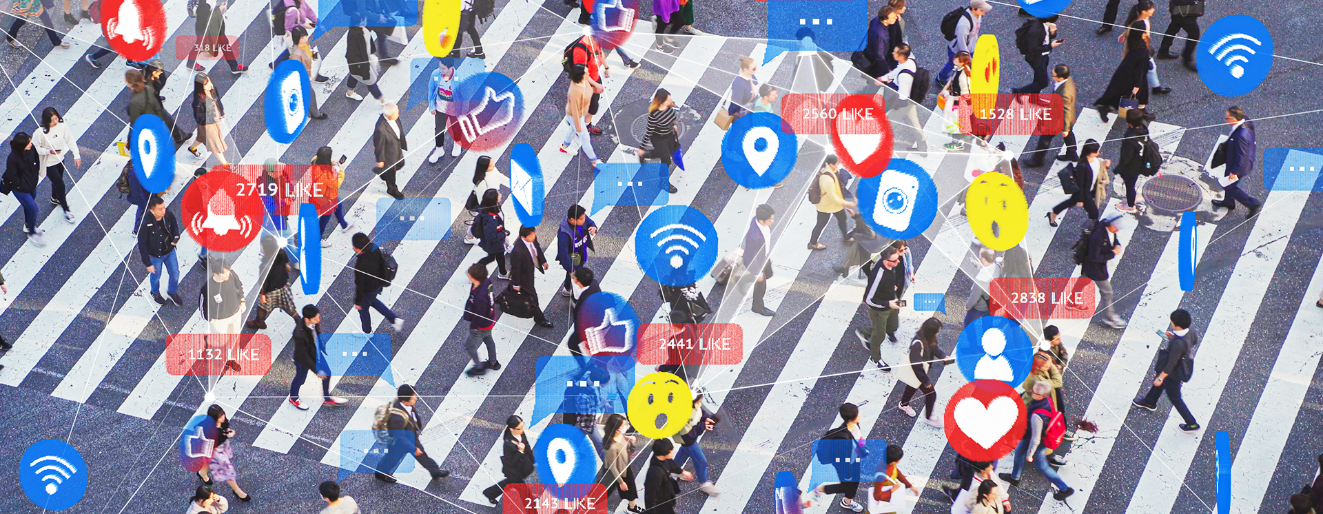 People walking across zebra crossing with emoji's and digital symbols above their heads