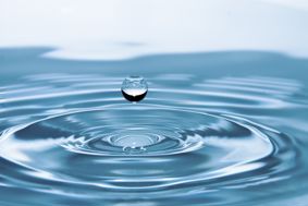 drop of water landing in a pool