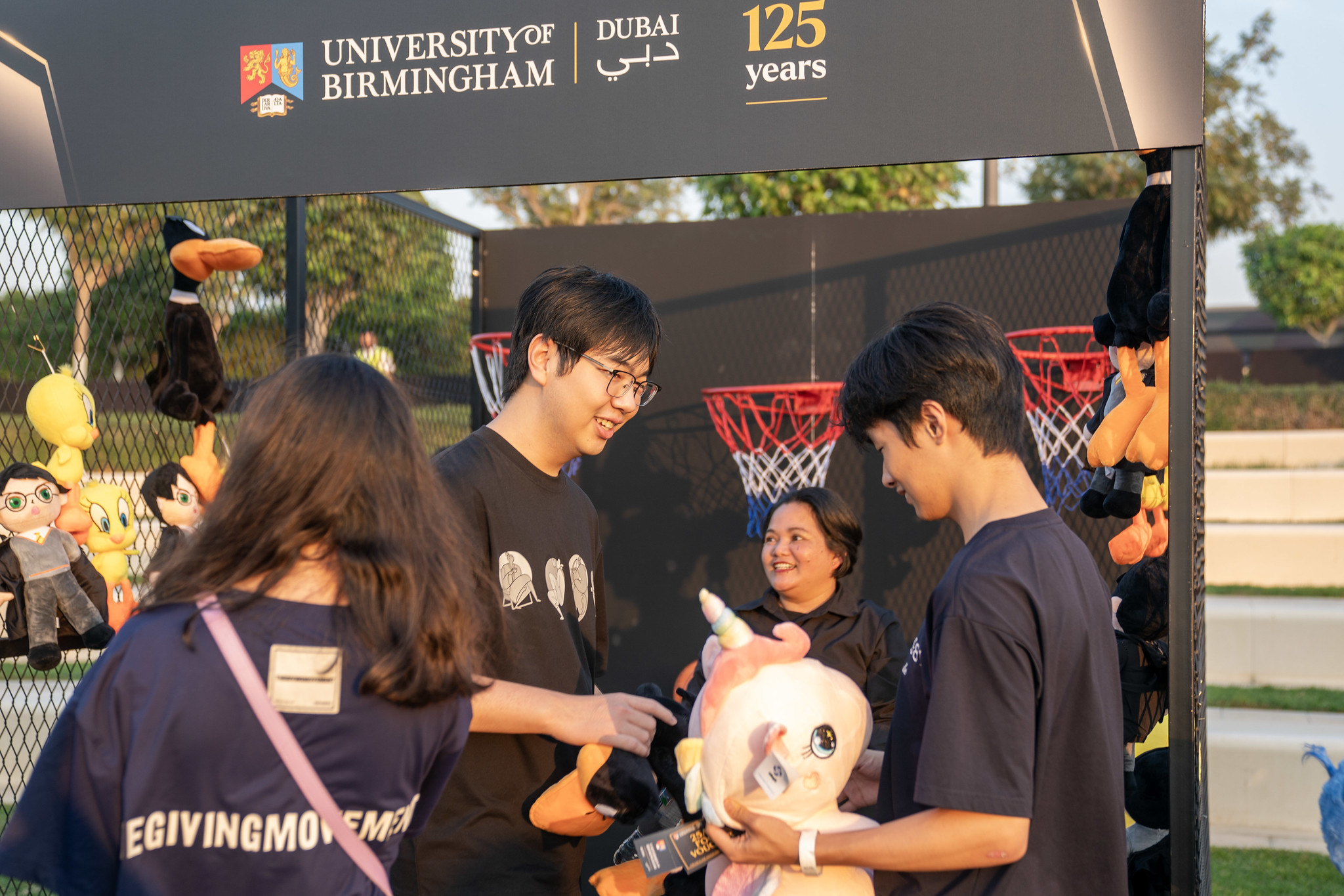 Students at an games stall on the University of Birmingham Dubai campus during the 125th anniversary festival.