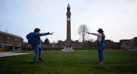 A duel, with bananas, in front of Old Joe, the University of Birmingham clock tower