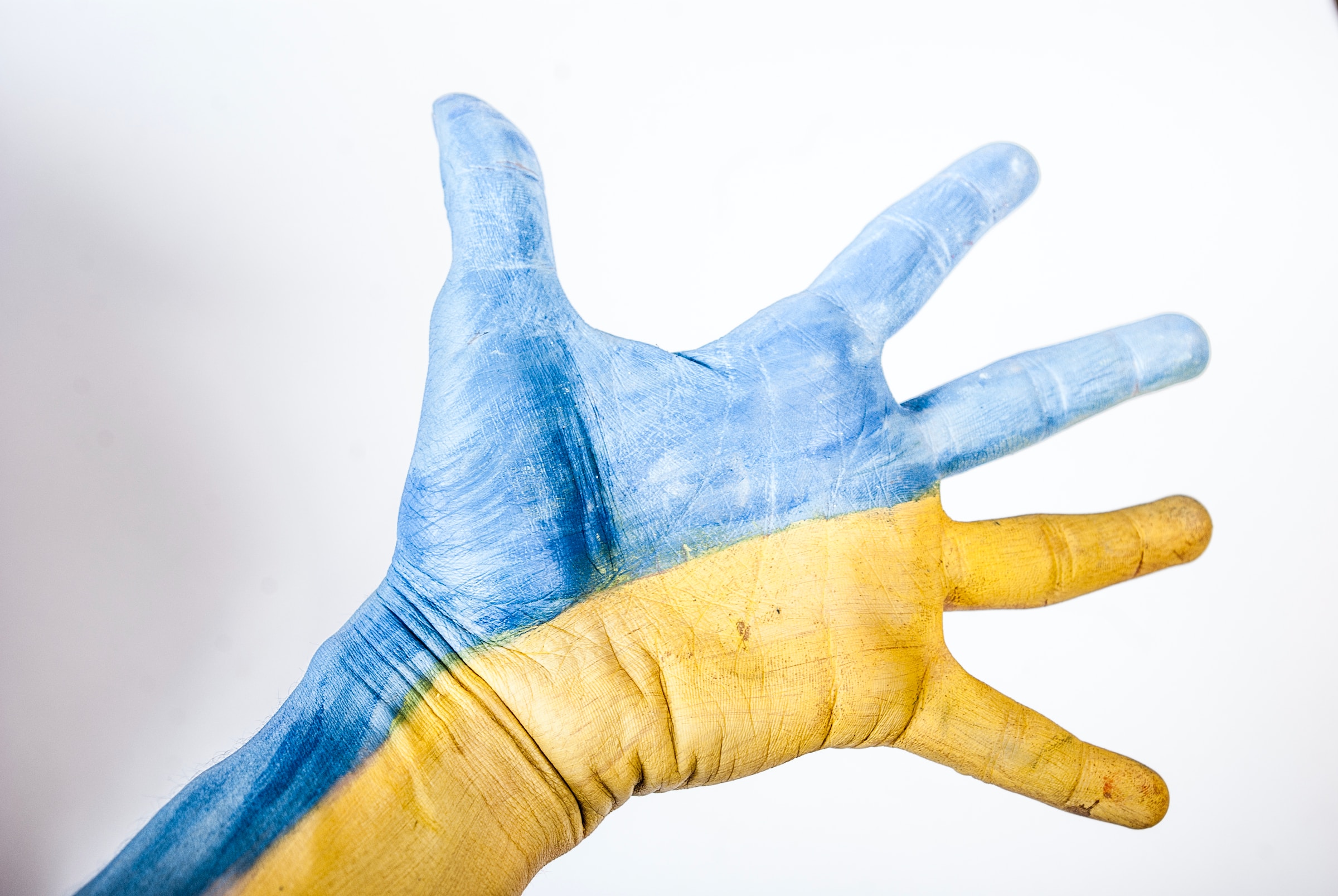 Open hand reaching - painted blue and yellow