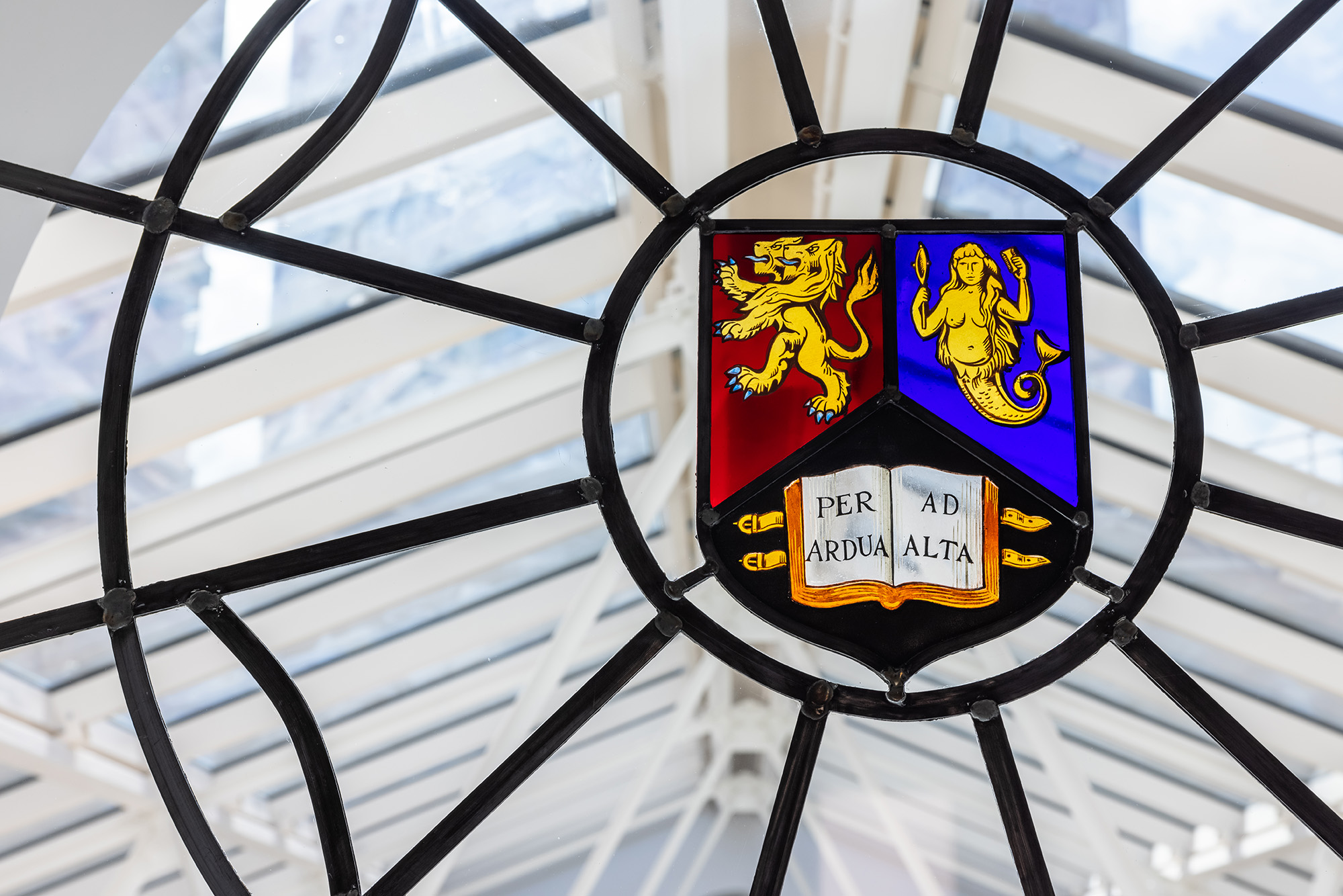 University crest in a stained glass window