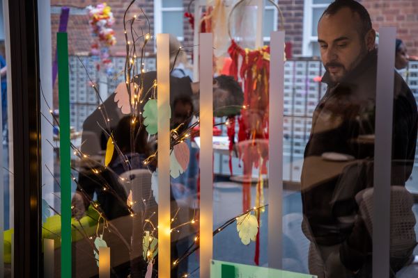 People standing in front of exhibition 