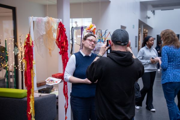 People standing in front of exhibition 