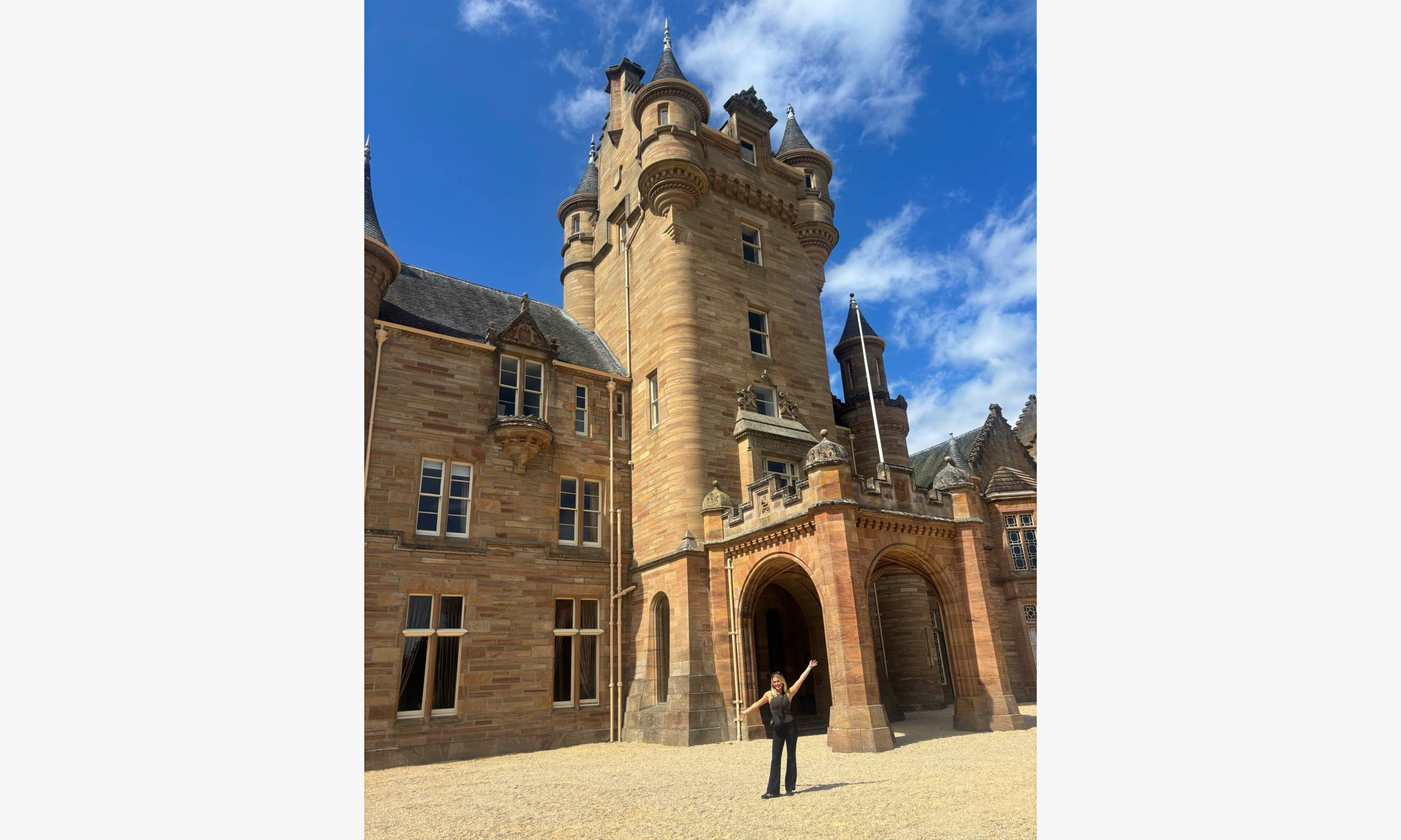 Elizabeth McGlynn in front of the Traitors castle