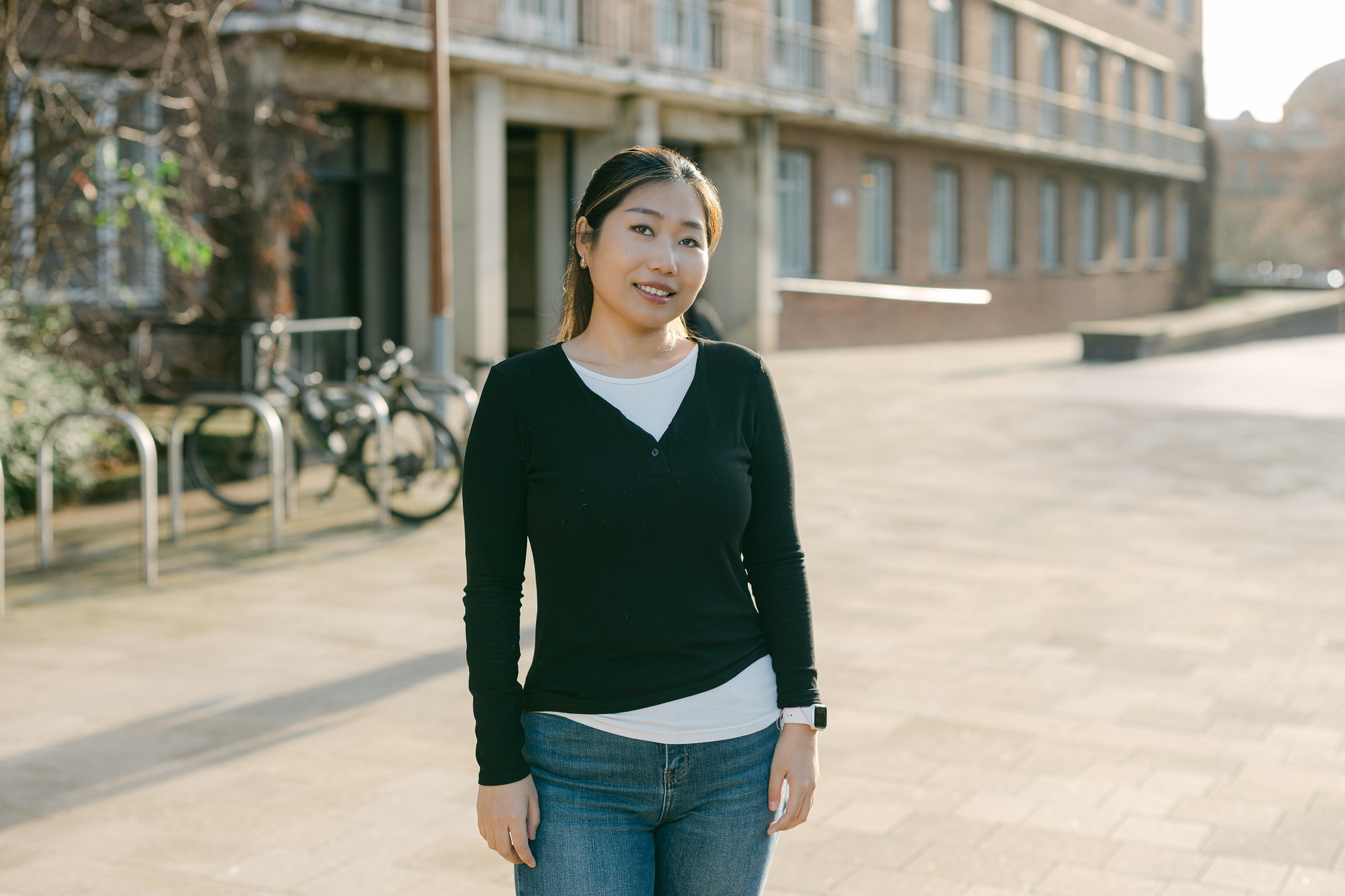 Han Wei standing in front of the Arts Building