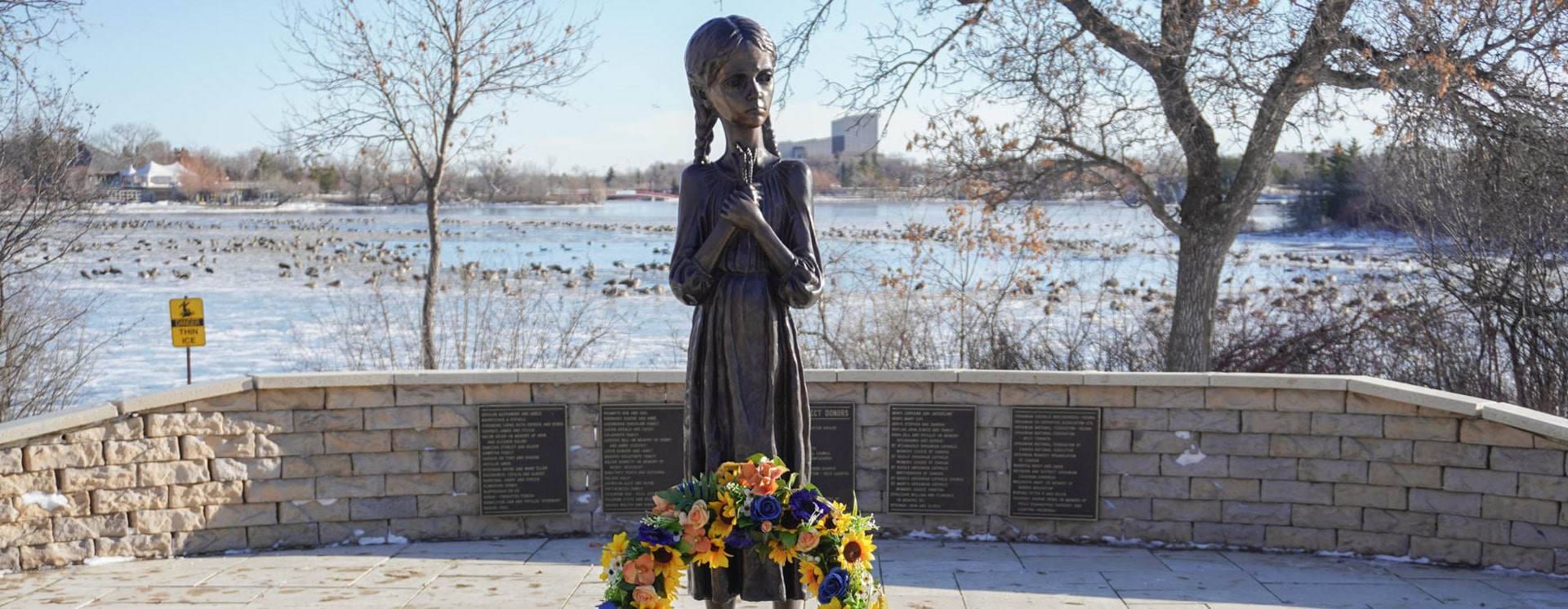 Statue of a small girl clutching ears of wheat to her chest at Ukraine’s National Museum of the Holodomor Genocide