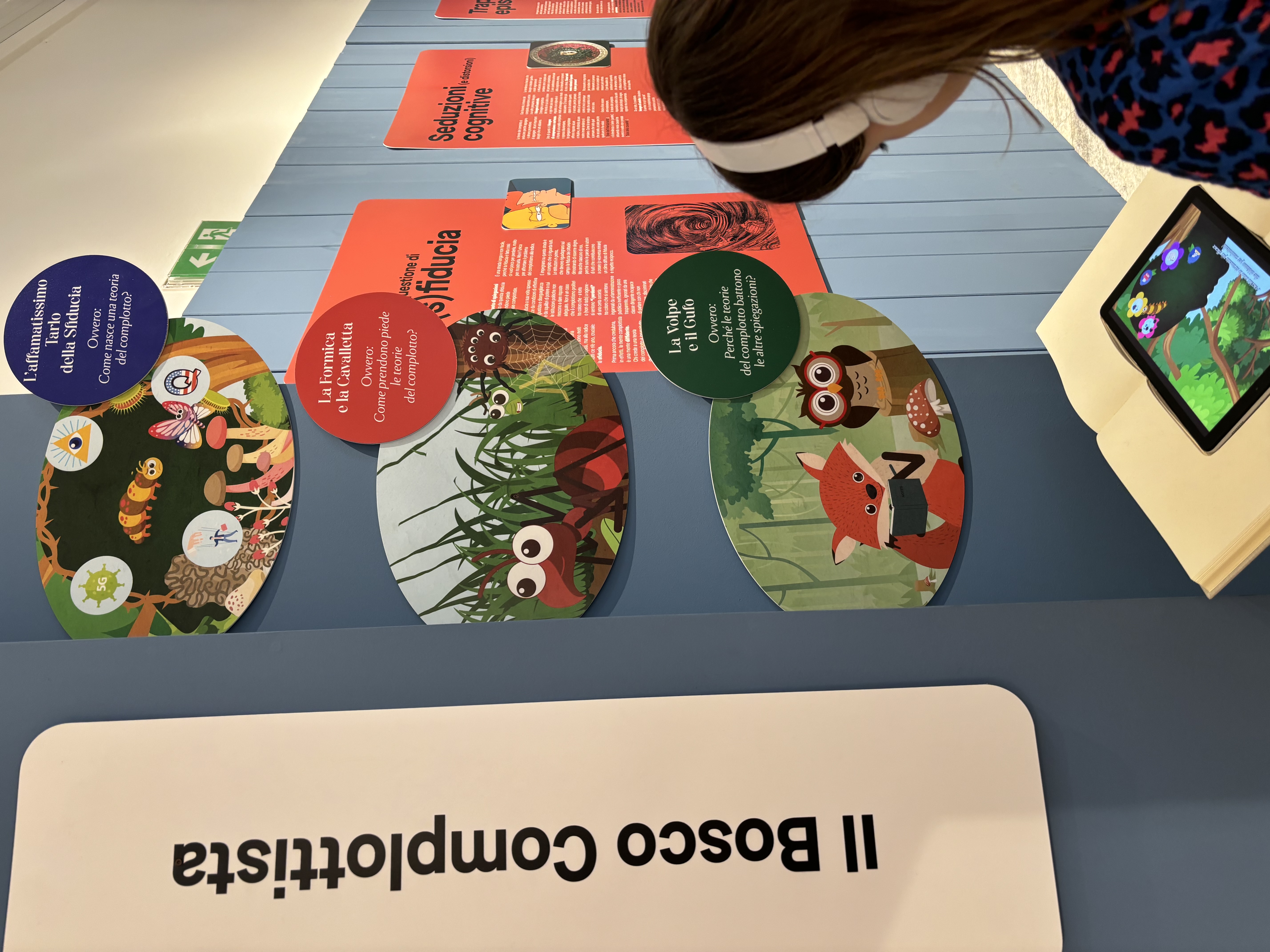 A participant watching one of the three featured videos curated for the museum.