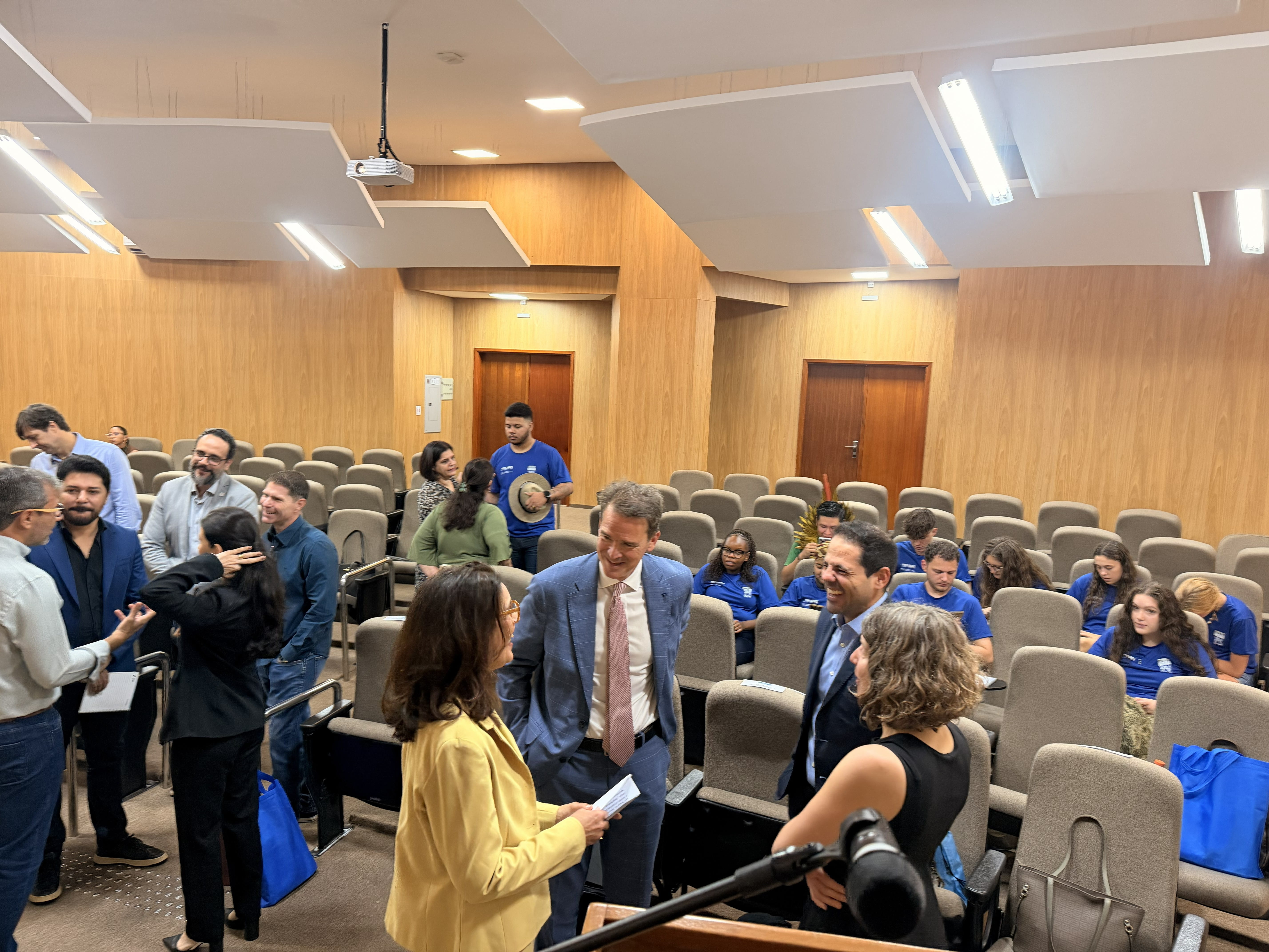 Academics and students socializing inside the UEMS auditorium before the official launch of the programme
