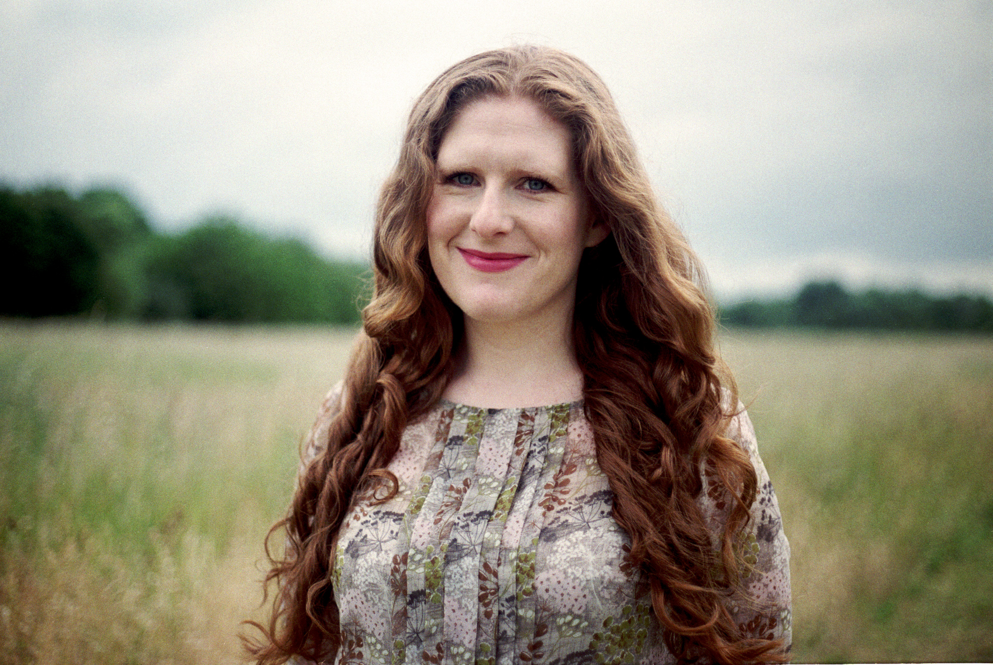 Cheryl Frances-Hoad, standing in a field