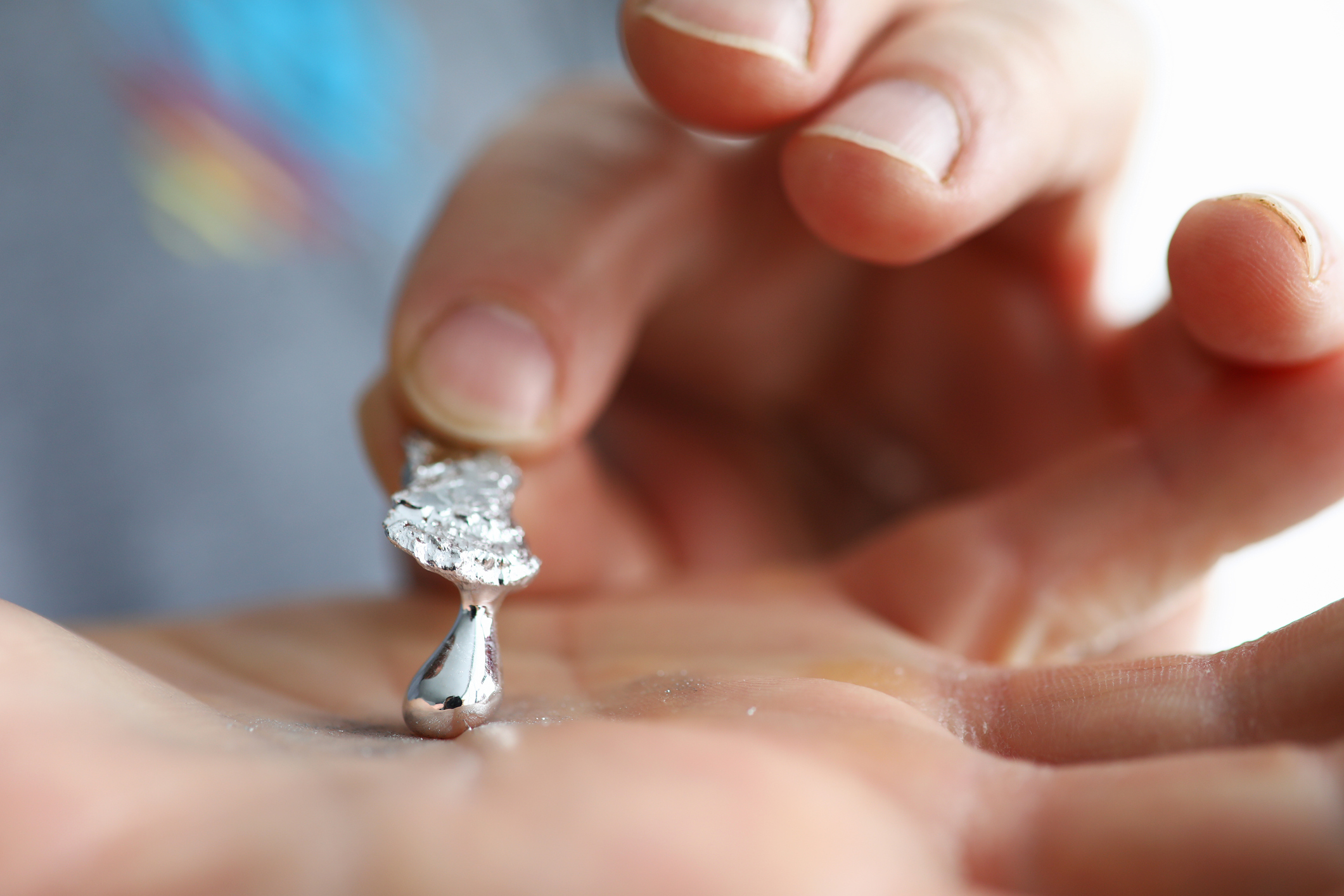 Liquid gallium held in the palm of the hand 