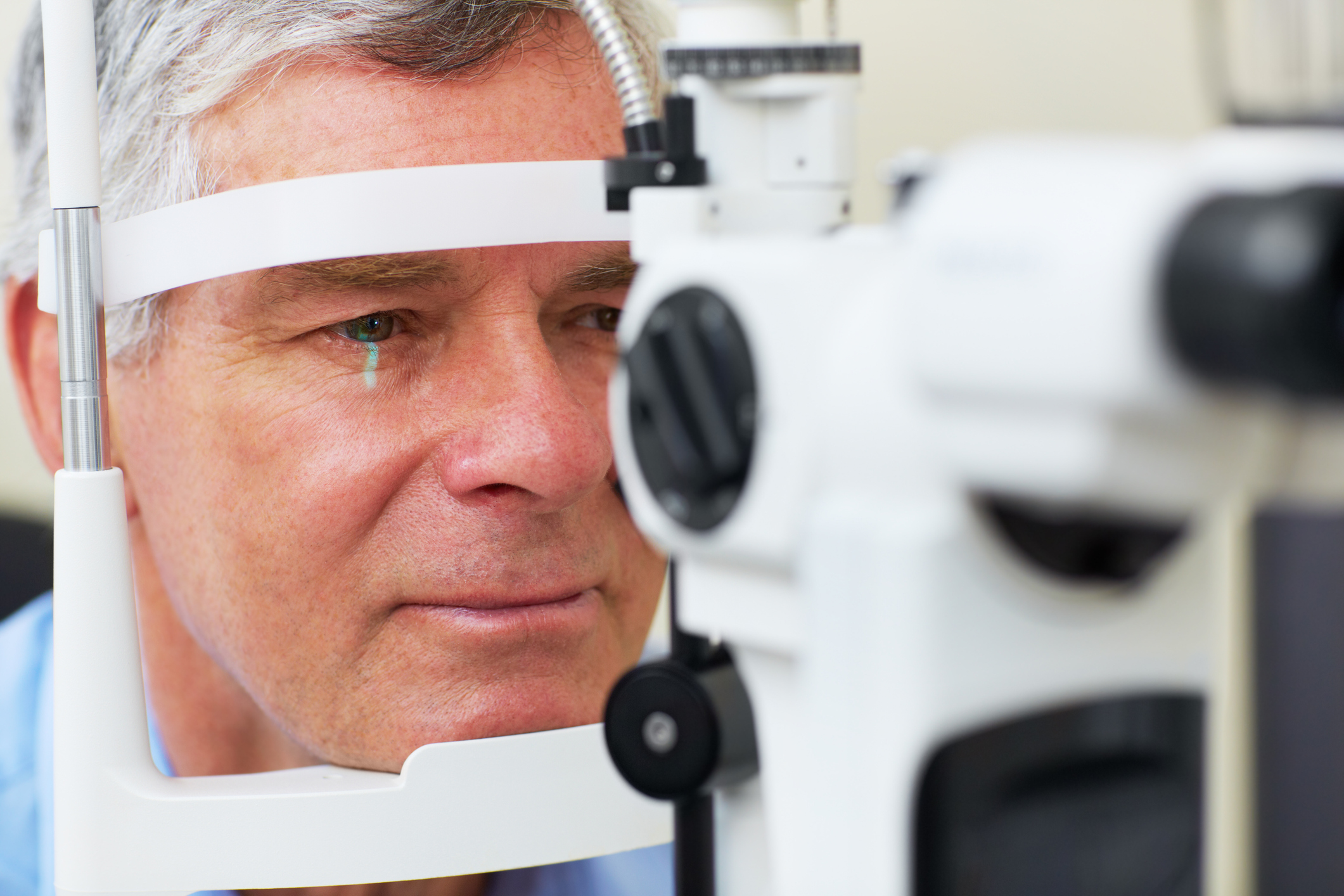 Middle aged man undergoing an eye test