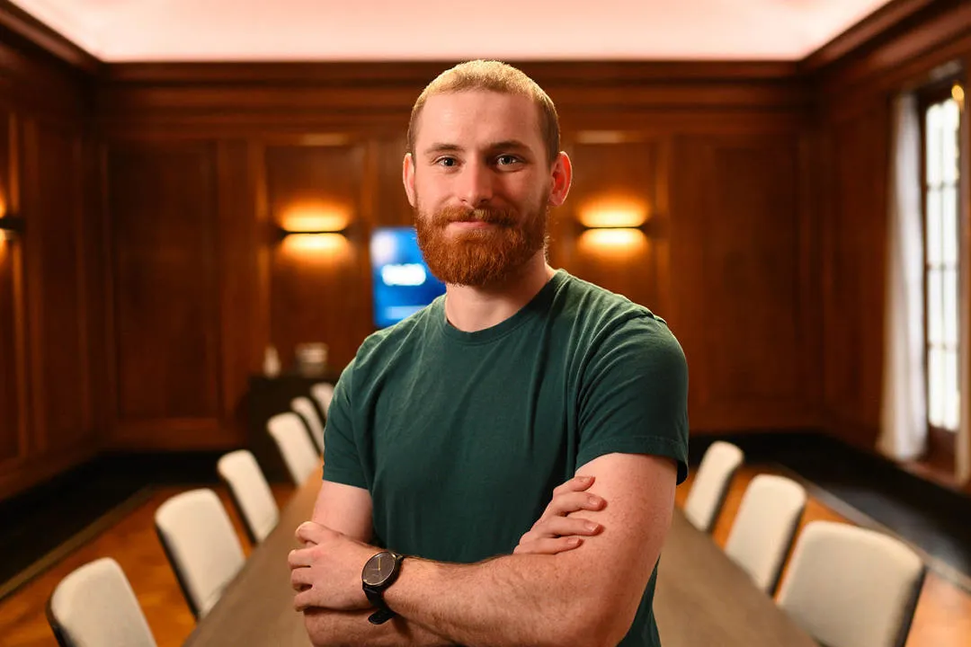 John Sewell poses in a boardroom
