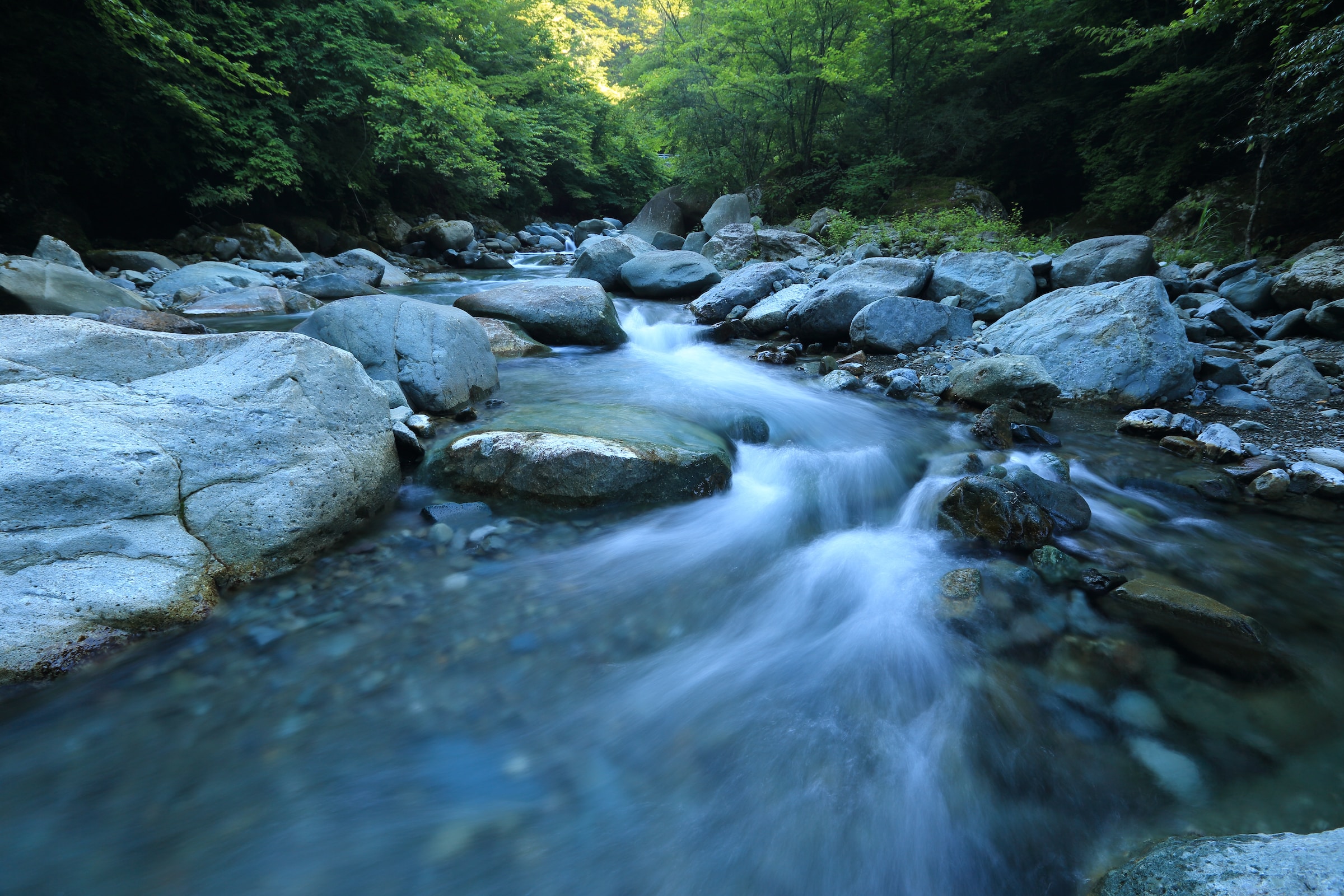 Fast flowing stream runs through rocks