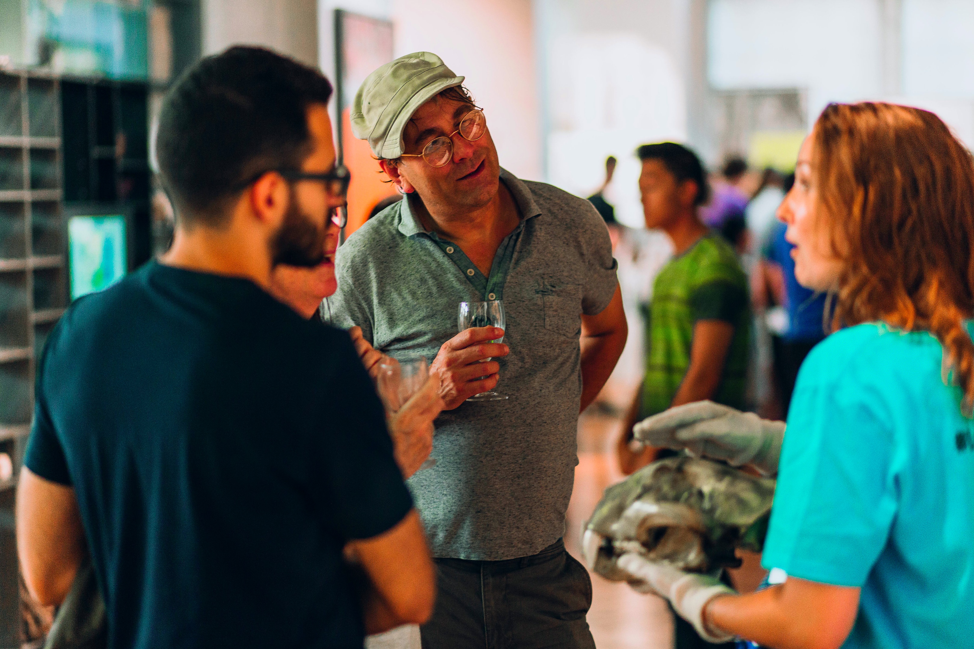 A group are shown a lion skull by a Museum Officer.