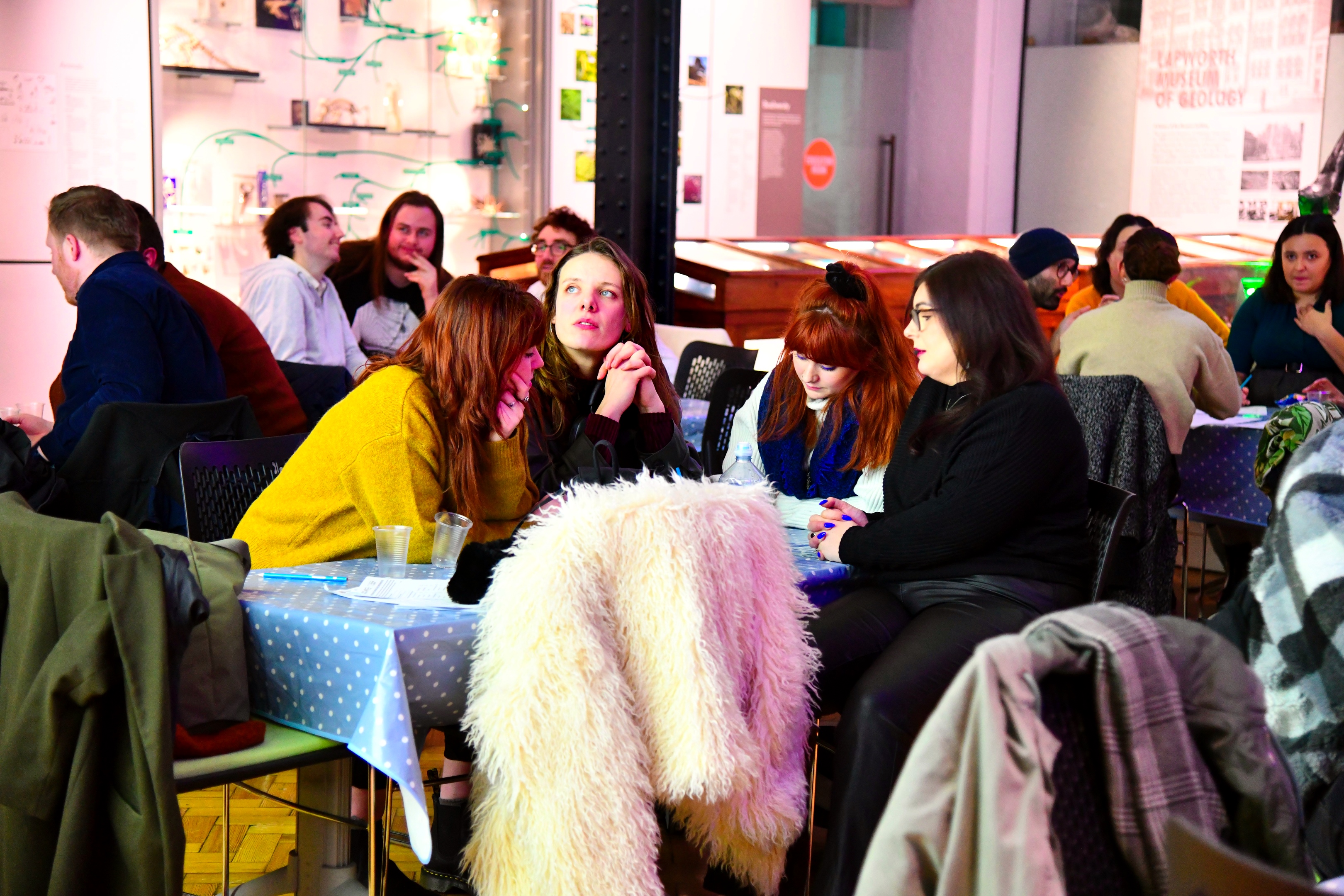 A crowd think over their answers to a quiz.
