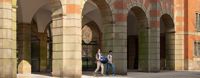 Students walking under the Law School arches