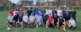 Group photo of players from the staff and student teams
