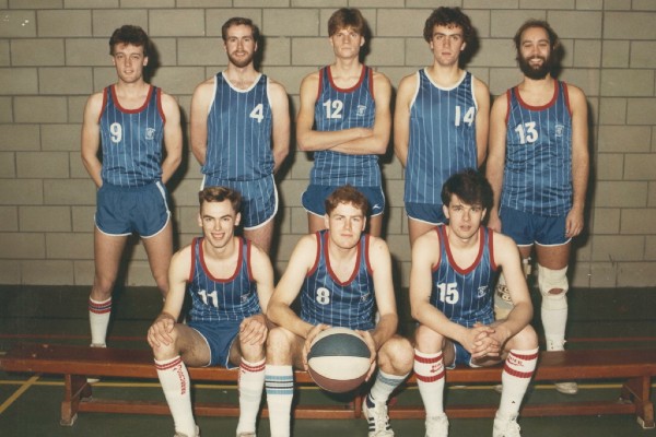 basketball team posing with a ball