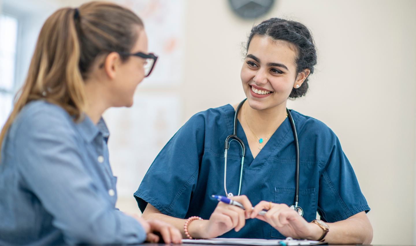 A female doctor and patient sat facing each other.
