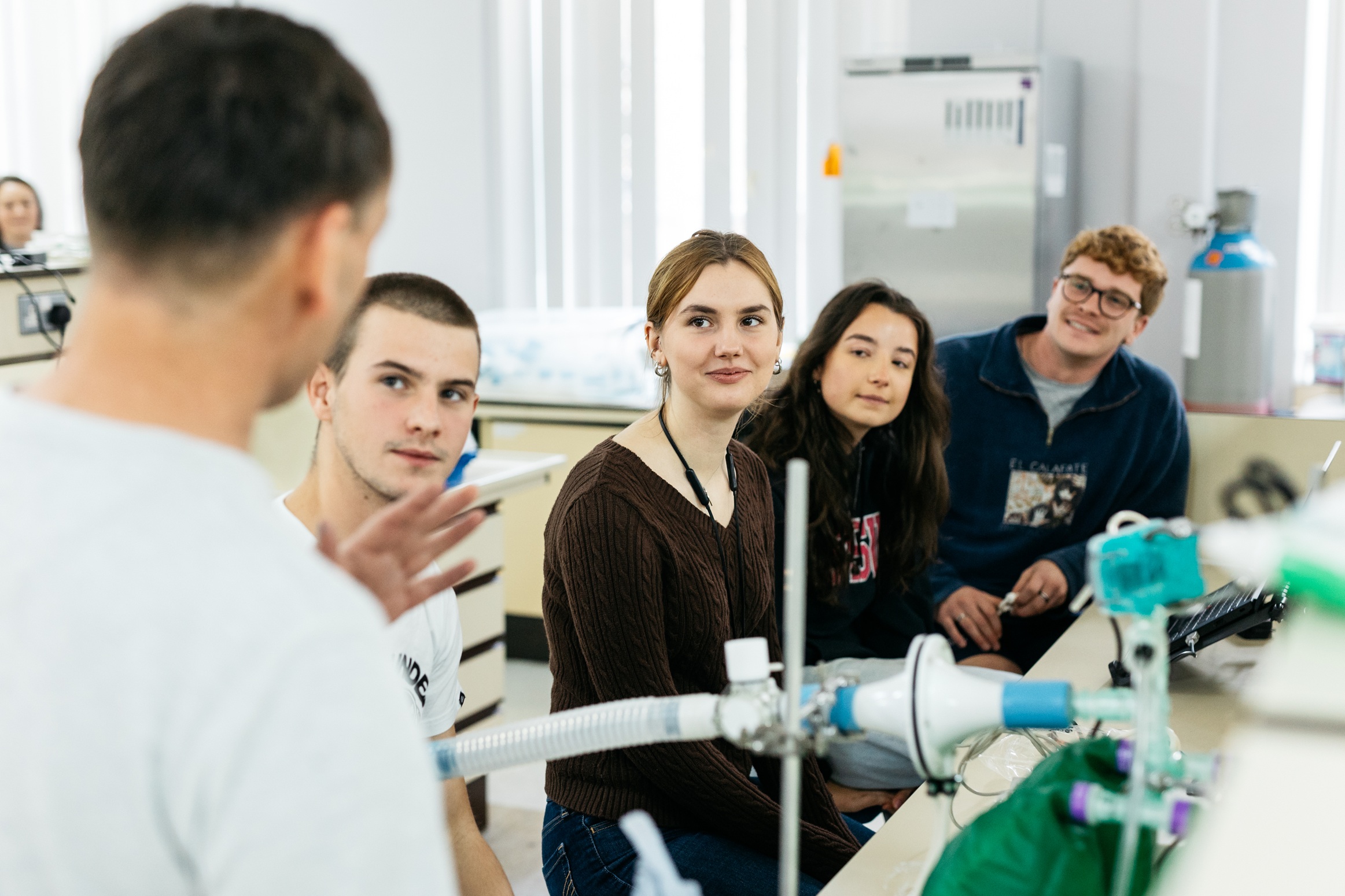 Group of medical students in discussion in a lab setting