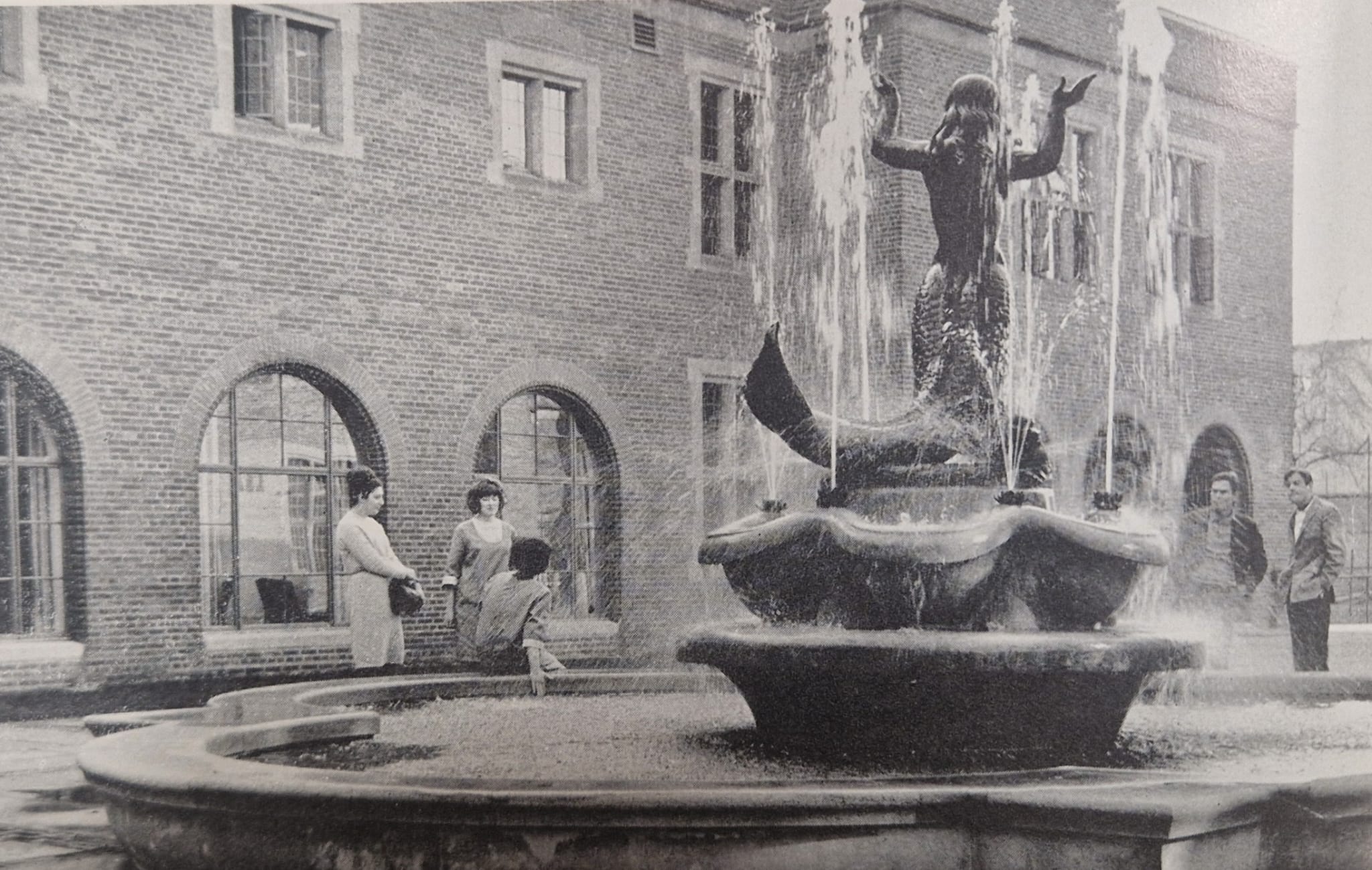Black and white image of the back of the Guild mermaid statue from the 1960s.