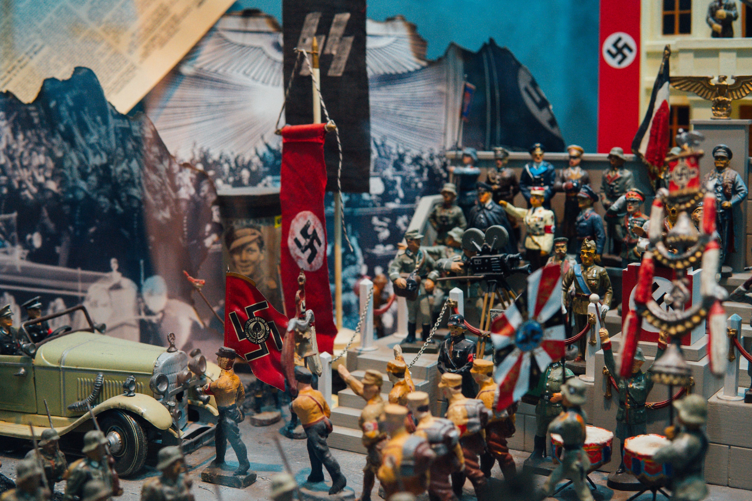 Nazi soldier figurines set up in a parade with swastika banners and flags