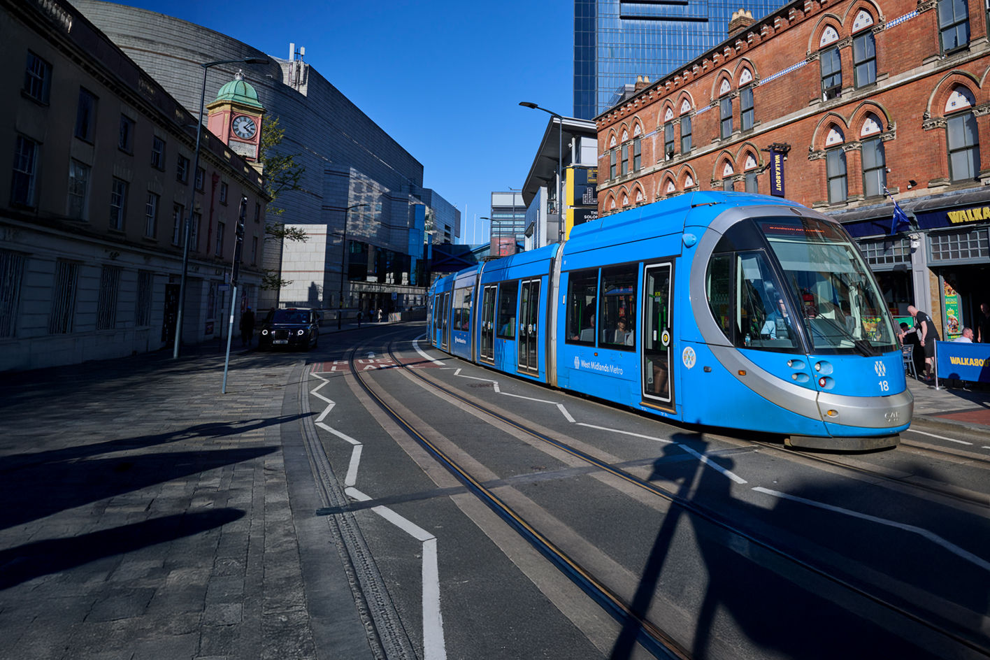 A metro train travelling along Broad Street in Birmingham