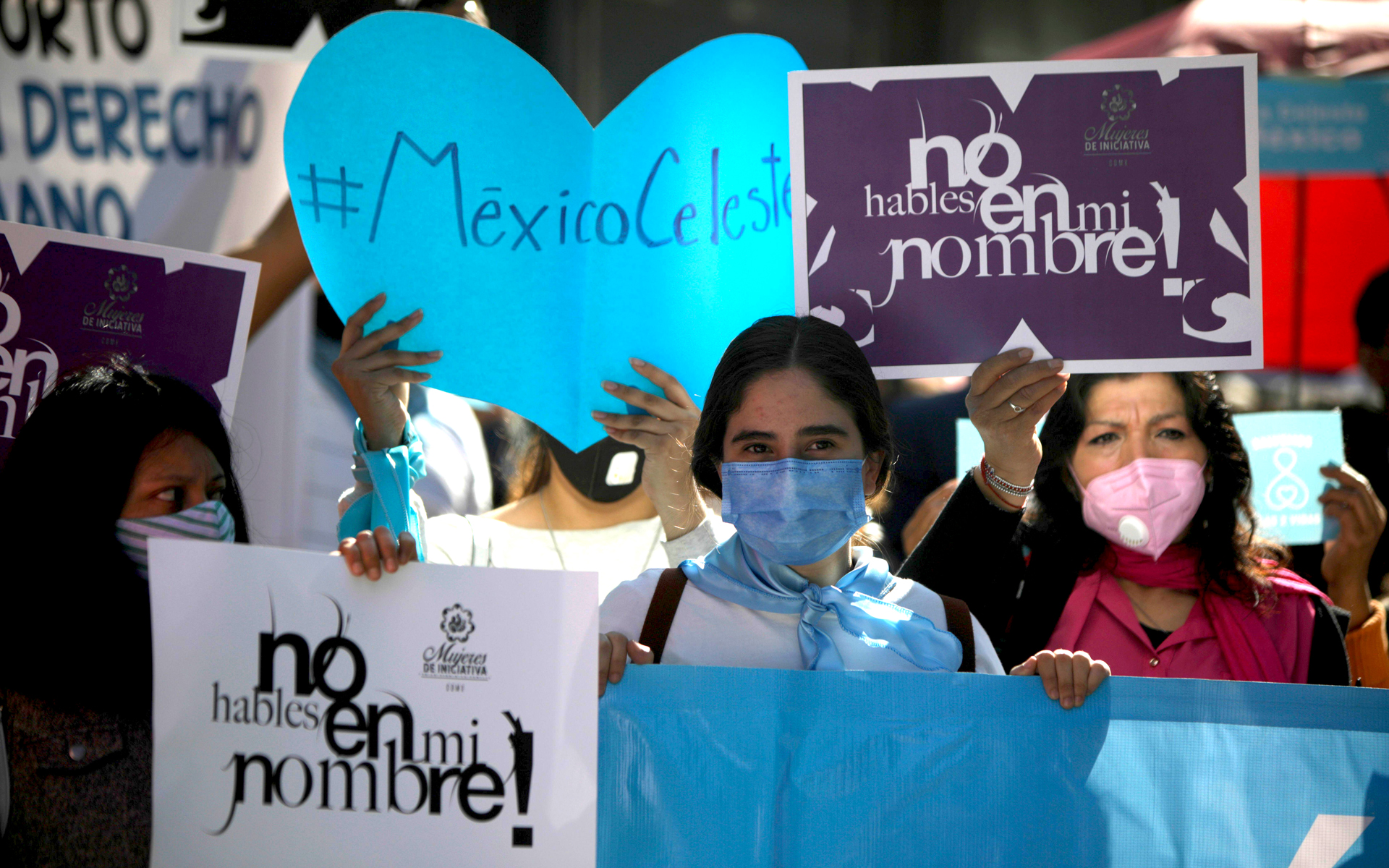 Women of the National Front For Family hold up placards during a protest against the legalisation of abortion in Mexico