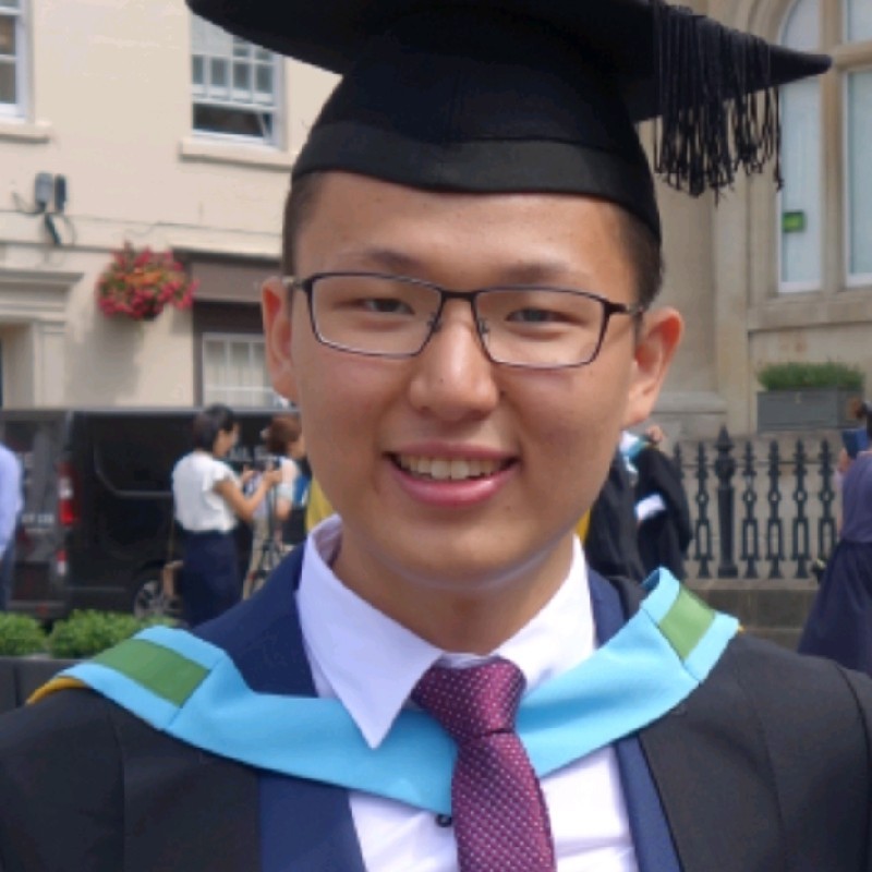 Chun Kiat Ong at his graduation, wearing a cap and gown
