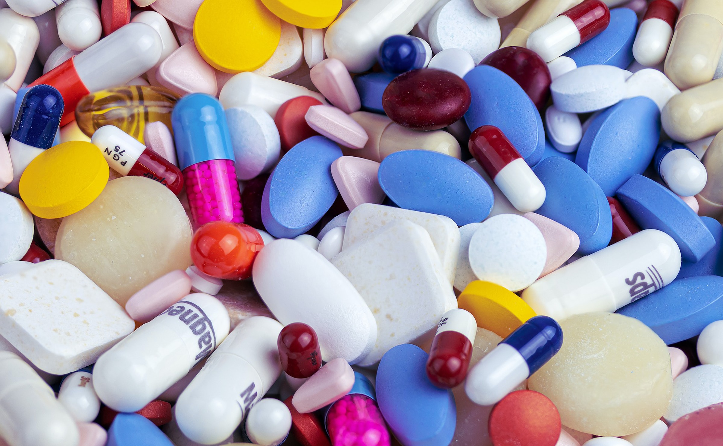 Hundreds of brightly coloured tablets and capsules