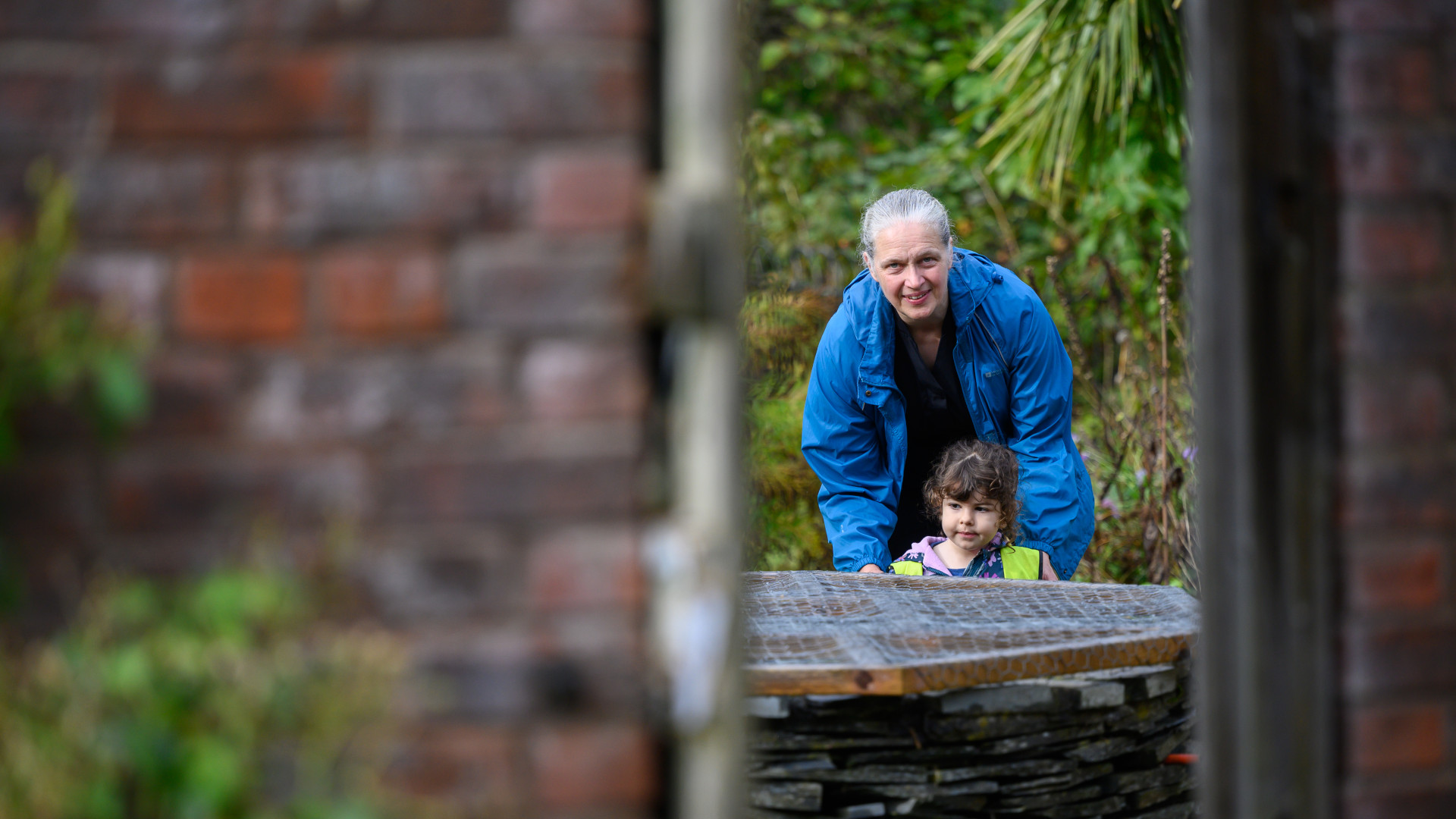 A member of staff with a child