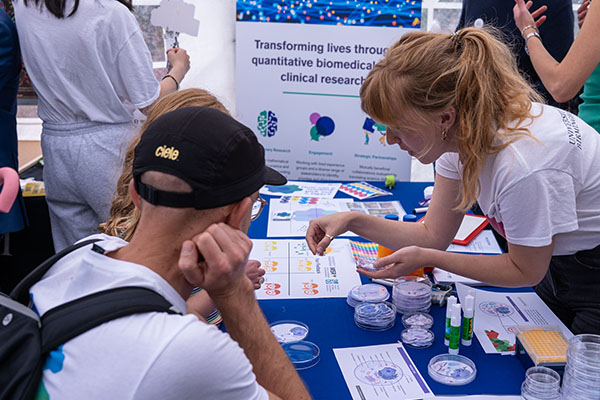 Researcher helping out at a stall