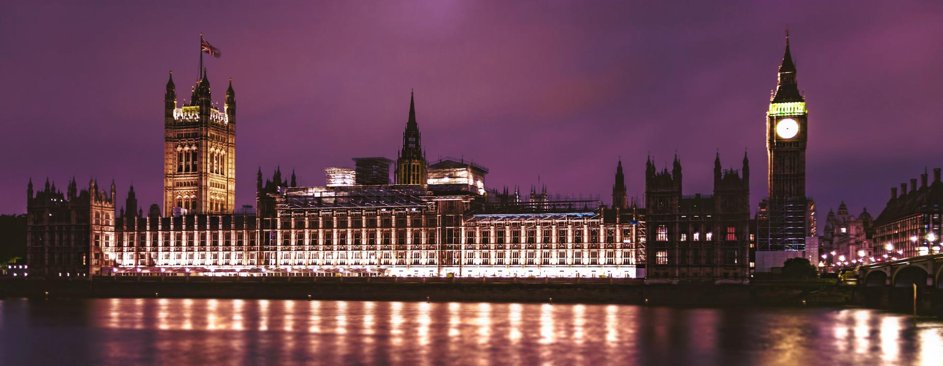 View of the Houses of Parliament at dusk from across the Thames