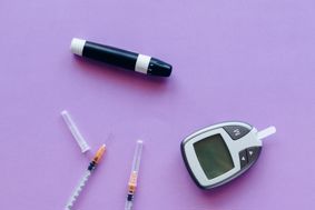 Various medical equipment involved in the treatment of type 1 Diabetes against a purple background