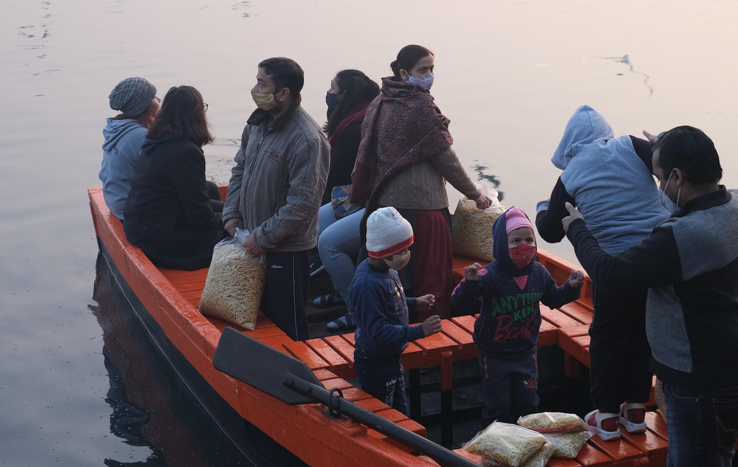Migrants board a small boat